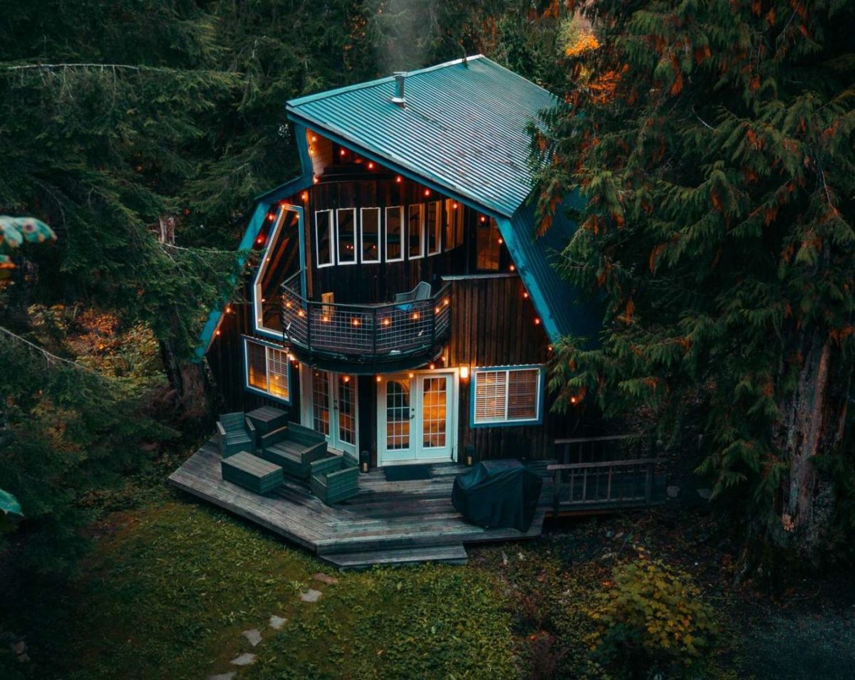 An A-frame chalet with string lights in Mt. Baker Rim